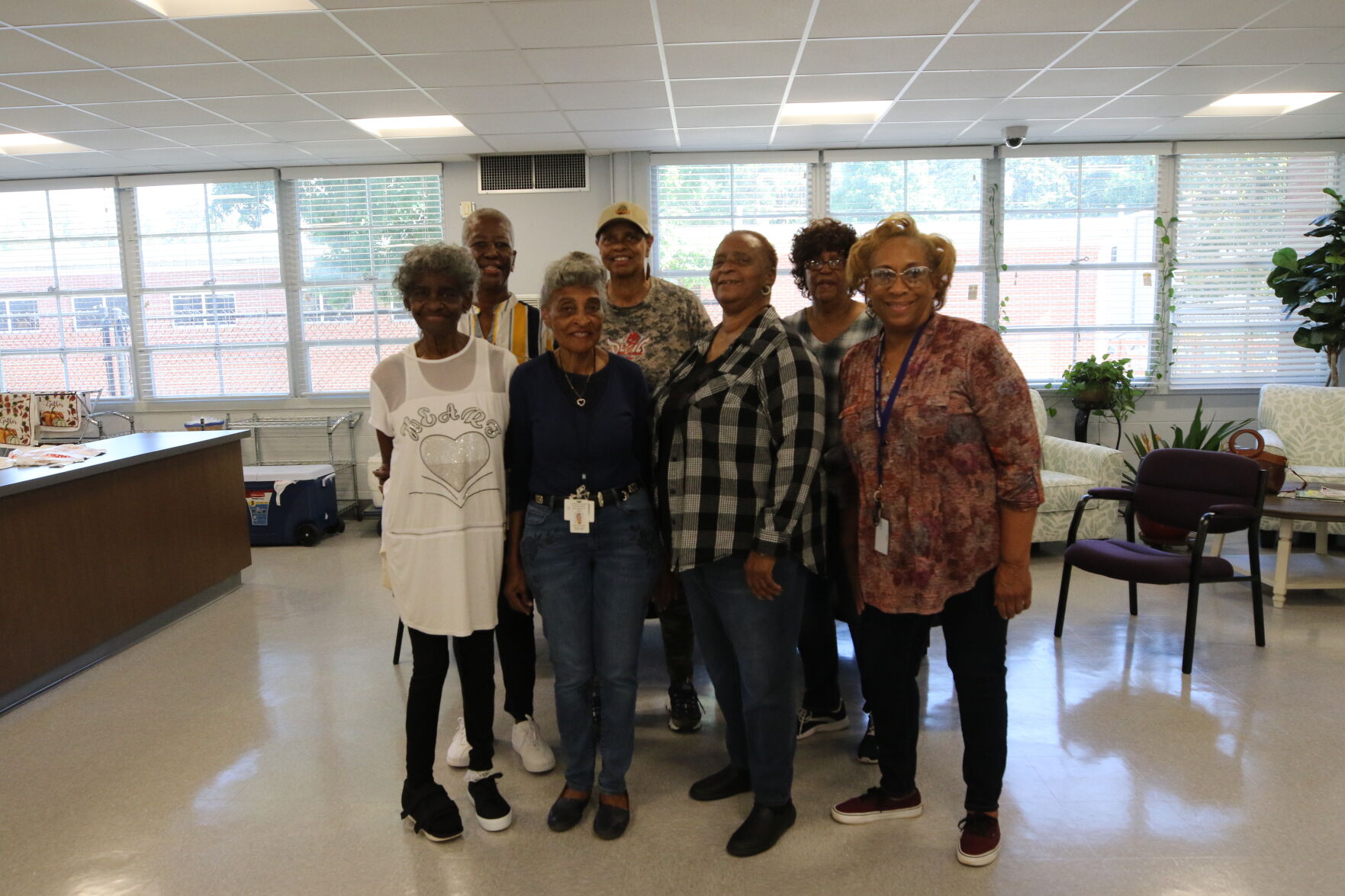 Site committee smiles ahead of Friday program